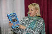 День туристической книги в Усть-Илимске. Терентьева О. проводит обзор изданий из фондов МБУК «ЦБС» г. Усть-Илимска